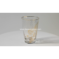 drinking glass with gold decoration